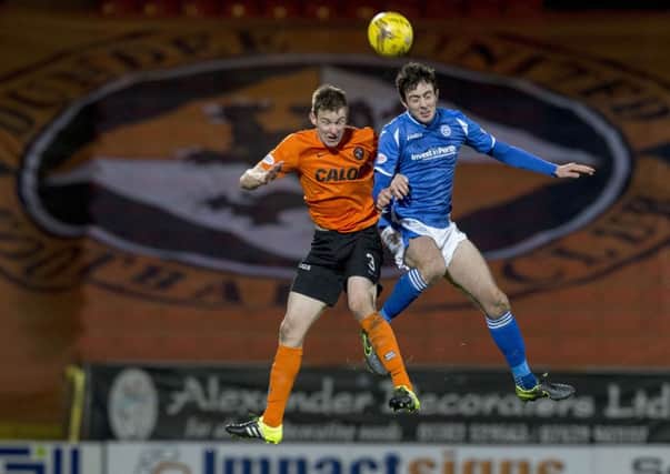 Paul Dixon (left) battles with St Johnstone's Joe Shaughnessy. Picture: SNS