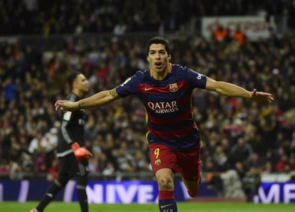 Luis Suarez celebrates after scoring . Picture: AFP/Getty