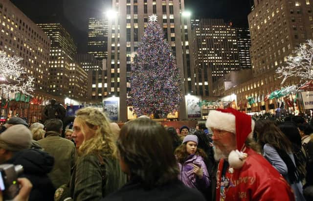Shoppers from the UK may find it cheaper to admire the Christmas lights than buy too many Christmas presents if they are visiting New York this festive season. Picture: Getty