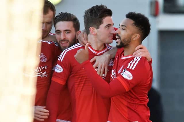Aberdeen's Kenny McLean, centre, celebrates his goal with team-mate Shay Logan. Picture: SNS