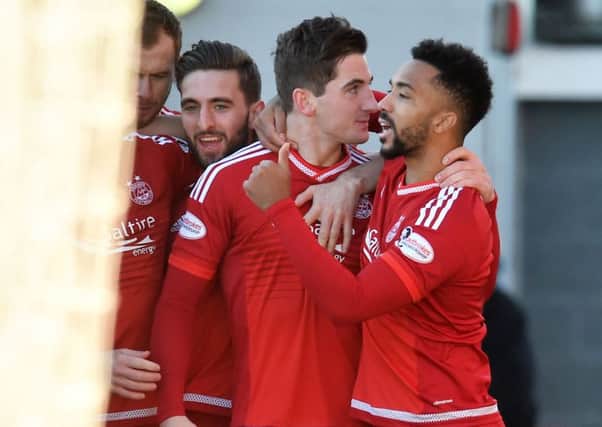 Aberdeen's Kenny McLean, centre, celebrates his goal with team-mate Shay Logan. Picture: SNS