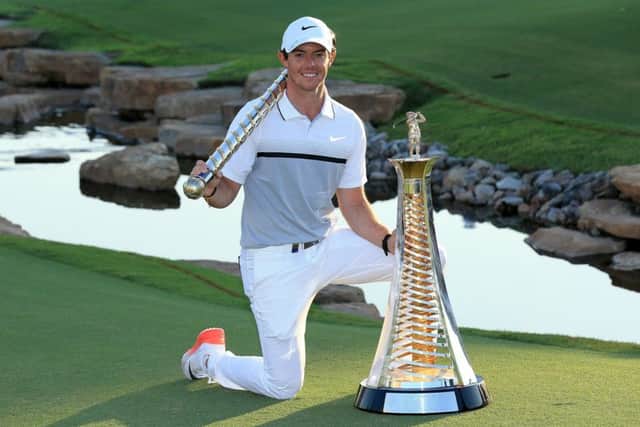 Rory McIlroy poses with the DP World Tour Championship and Race to Dubai trophies after his one-shot win at Jumeirah Golf Estates. Picture: Getty
