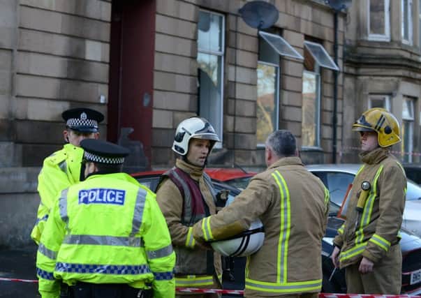 Firefighters and police officers outside the property on Lendel Place. Picture: Hemedia
