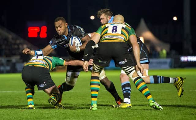 Glasgow Warriors lock Leone Nakarawa, second from left, is tackled by Northamptons Alex Waller during Saturdays clash. Picture: SNS