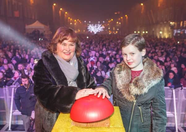 Susan Boyle turns on the Edinburgh Christmas lights with Gracie Linn, 10. Picture: Toby Wlliams