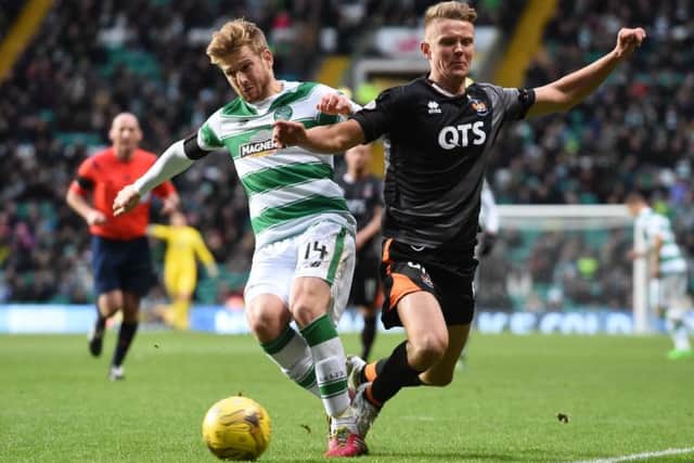 Celtics Stuart Armstrong holds off a challenge by Mark OHara. Pciture: SNS