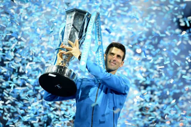 Novak Djokovic holds aloft the trophy after winning the final of the ATP World Tour Finals at the O2 Arena in London. Picture: PA
