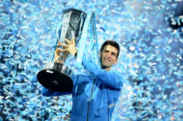Novak Djokovic holds aloft the trophy after winning the final of the ATP World Tour Finals at the O2 Arena in London.  Picture: PA
