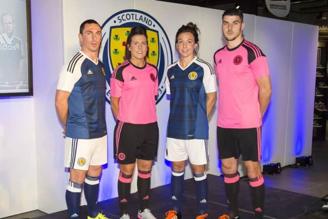 Leanne Crichton and Rachel Corsie with Scott Brown and Callum Paterson as the quartet gathered to model the new Scotland kits. Picture: SNS