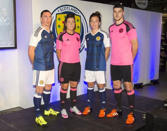 Leanne Crichton and Rachel Corsie with Scott Brown and Callum Paterson as the quartet gathered to model the new Scotland kits. Picture: SNS
