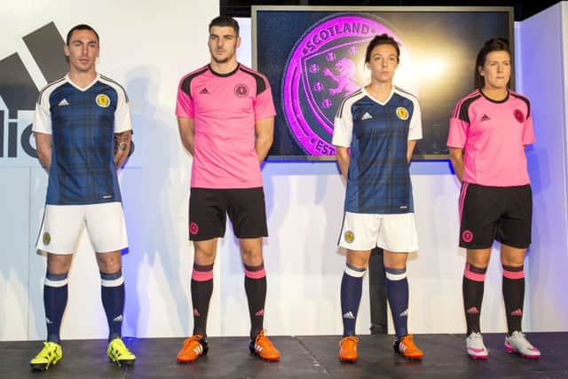 Scott Brown, Callum Paterson, Rachel Corsie and Leanne Crichton unveil the new Scotland home and away kit. Picture: SNS