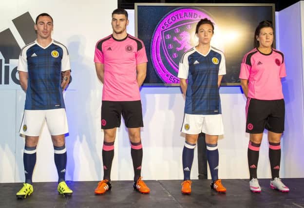 Scott Brown, Callum Paterson, Rachel Corsie and Leanne Crichton unveil the new Scotland home and away kit. Picture: SNS
