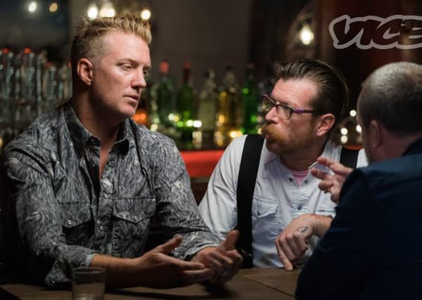 Josh Homme (left) and Jesse Hughes (centre) of the Eagles of Death Metal speak about the Bataclan horror. Picture: PA