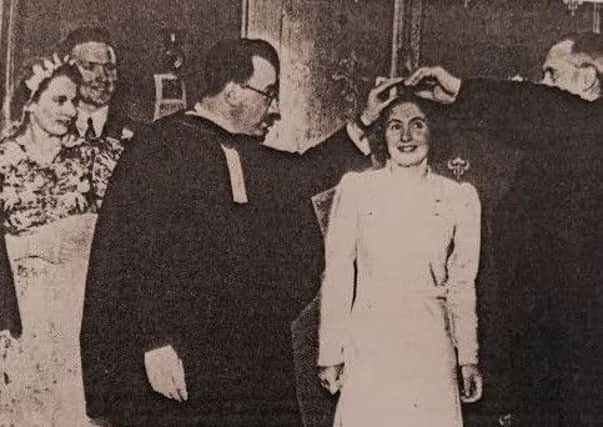 Mrs Frances Birse (nee Wood) is measured for the dowry in 1941