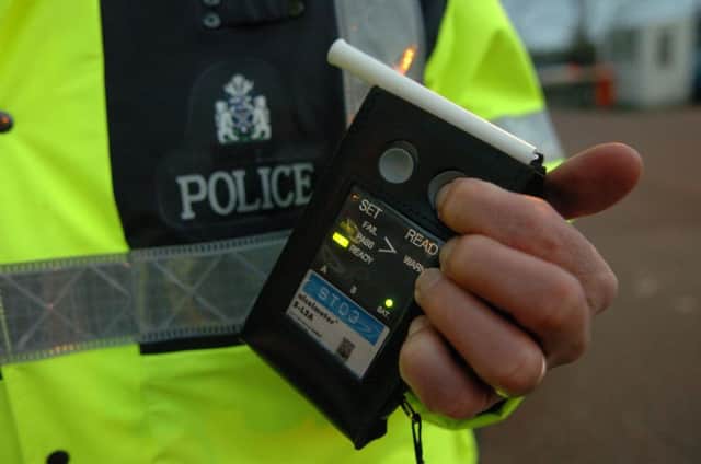 Superintendent Colin McNeil of the Traffic Police, outside Fettes Headquarters with a breathalyser.