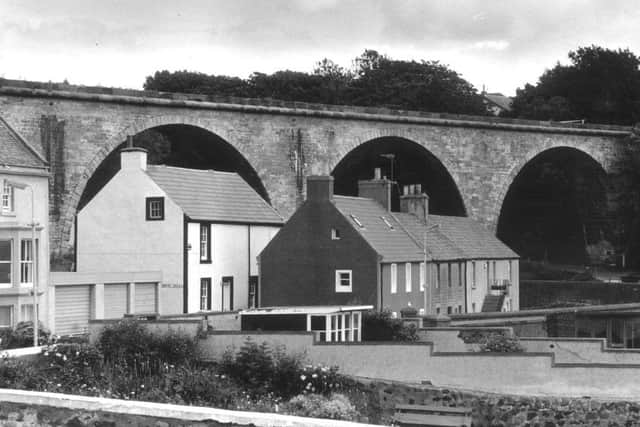 A picture of Lower Largo in Fife - pic shows a railway viaduct above a row of houses.