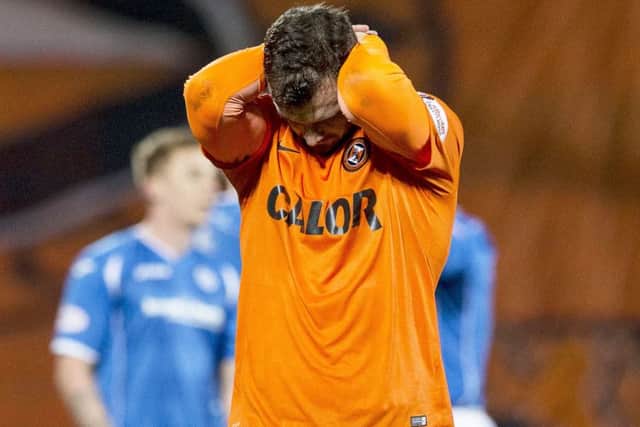 Dundee Utd debutant Gavin Gunning cuts a dejected figure at full time. Picture: SNS