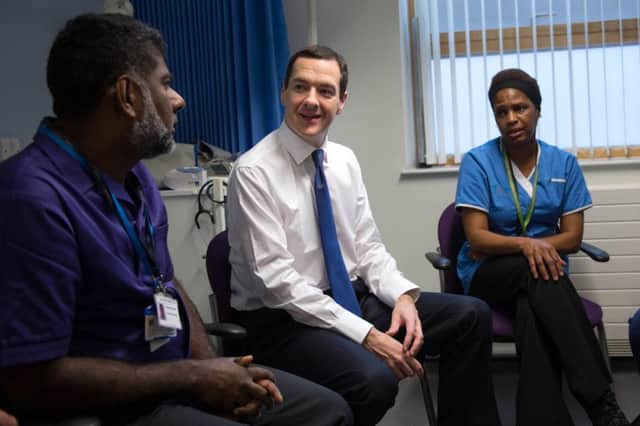 Chancellor of the Exchequer George Osborne meets NHS staff in London yesterday. Picture: PA