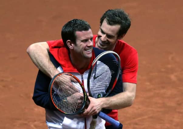 Andy Murray and GB captain Leon Smith in good spirits during practice in Ghent yesterday. Picture: PA