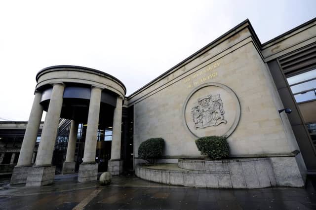 The pair were led handcuffed to the cells at the High Court in Glasgow yesterday. Picture: John Devlin