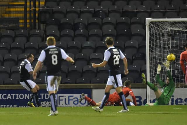 Mark Stewart, far left, beats St Mirren goalkeeper Jamie Langfield to open the scoring for Raith Rovers at Starks Park last night. Picture: SNS