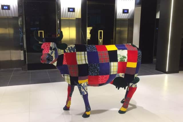 The 150 St Vincent Street reception area features a colourful Highland cow