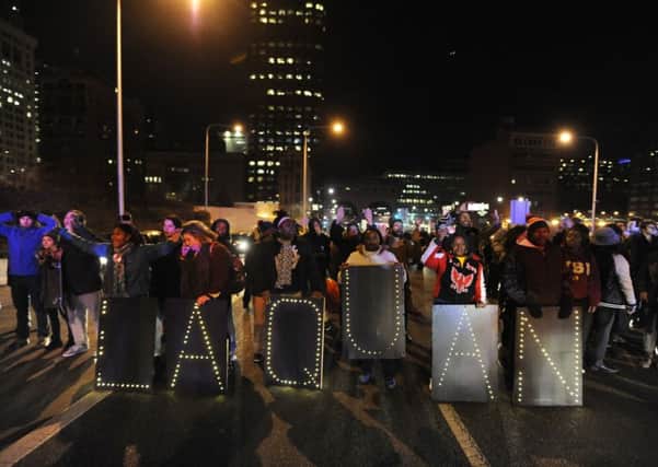 Protesters march during a demonstration for 17-year-old Laquan McDonald early Wednesday. Picture: AP