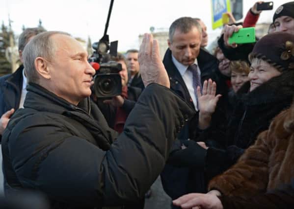 Putin is greeted by supporters. He warned Russians not to visit Turkey because of possible "significant danger". Picture: AP
