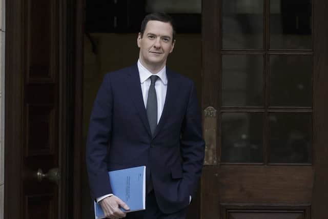 Chancellor George Osborne leaves the Treasury to deliver his statement in the House of Commons. Picture: Tim Ireland/PA Wire