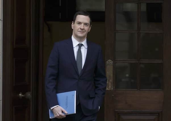 Chancellor George Osborne leaves the Treasury to deliver his statement in the House of Commons. Picture: Tim Ireland/PA Wire