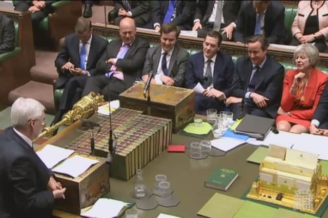 The book lies in the middle of the table after apparently being pushed towards George Osborne. Picture: PA