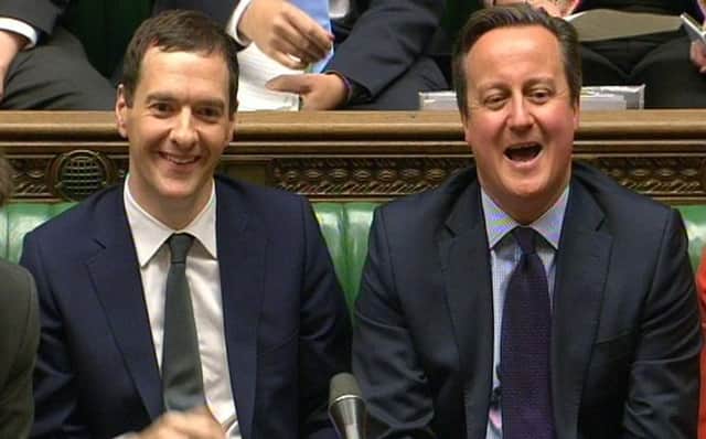George Osborne and David Cameron in the Commons. Picture: PA