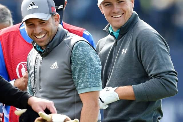 Jordan Spieth, right, was put on the clock in this years Open Championship at St Andrews while playing with Sergio Garcia, left. Picture: Ian Rutherford