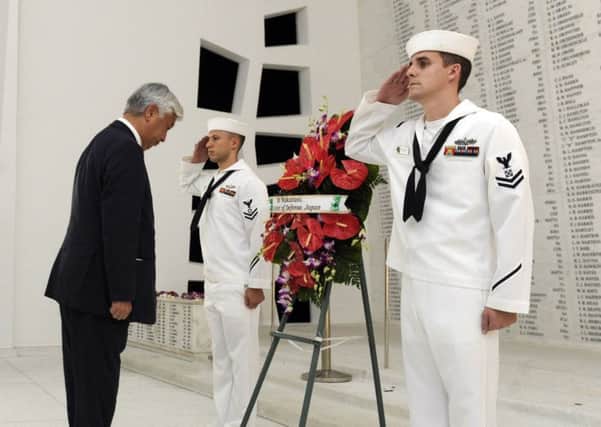 Japanese defence minister General Nakatani visits the USS Arizona shrine room. Picture: AP