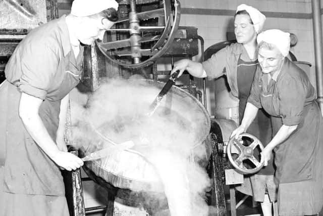 Thomas Tunnock Ltd biscuit factory in Uddingston - Caramel is poured out of bubbling cauldron