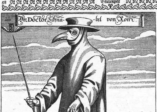 A plague doctor in protective clothing. Picture: Getty