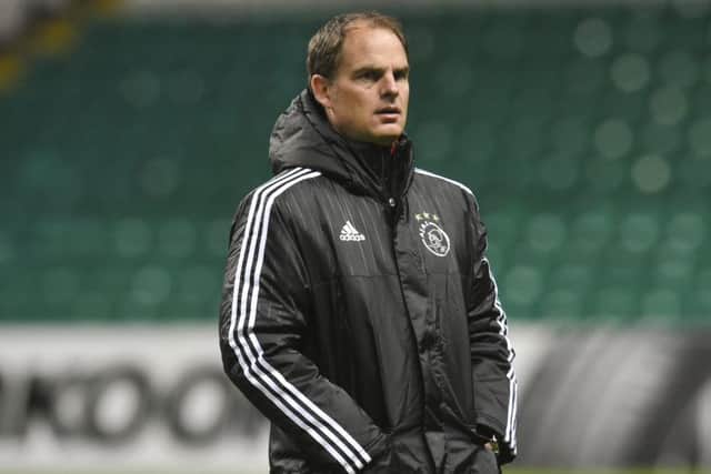 Frank de Boer watches over an Ajax training session on the Celtic Park turf. Picture: SNS