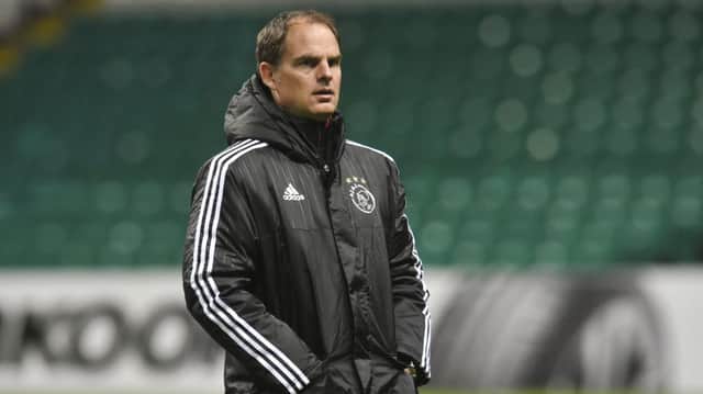 Frank de Boer watches over an Ajax training session on the Celtic Park turf. Picture: SNS