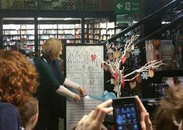 Author Cathy Rentzenbrink cuts the ribbon in Waterstones on Wednesday 25 November, opening the Wishing Tree for 2015. Photo: Literary Dundee