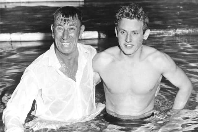 Ian Black (right) is joined in the pool by his coach Andy Robb after winning the 220 yards butterfly at the 1958 Commonwealth Games in Cardiff. Picture: Getty