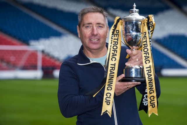 McInally with the Petrofac Cup. His Peterhead side are in the final against Rangers in April. Picture: SNS Group