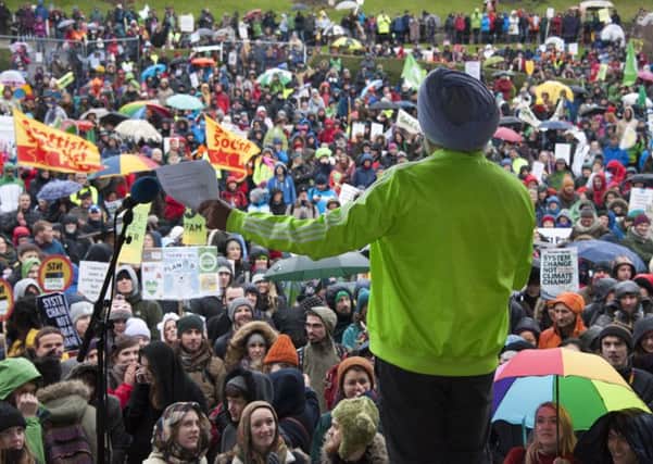 Hardeep Singh Kohli addresses the marchers as thousands of people marched in Edinburgh to demand action to tackle climate change. Picture: TSPL