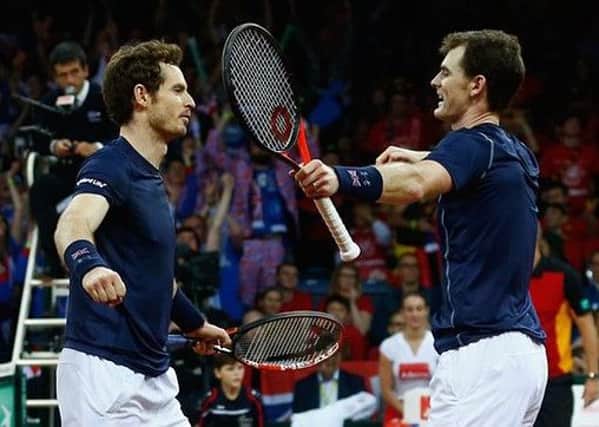 Andy and Jamie celebrate their doubles win. Picture: Getty