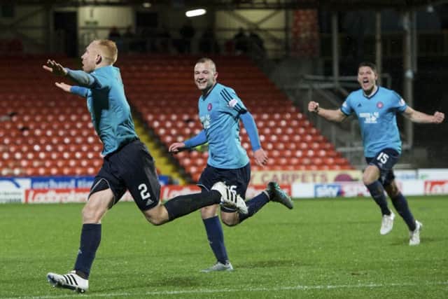 Ziggy Gordon (left) races off to celebrate after scoring to give Hamilton a 2-1 lead. Picture: SNS