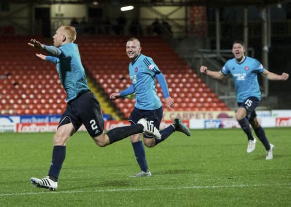 Ziggy Gordon (left) races off to celebrate after scoring to give Hamilton a 2-1 lead. Picture: SNS