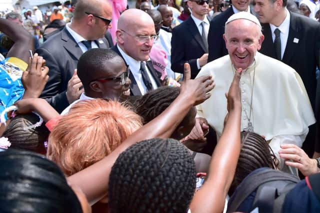 Pope Francis greets children in a refugee camp yesterday in Bangui. Picture: AFP/Getty Images