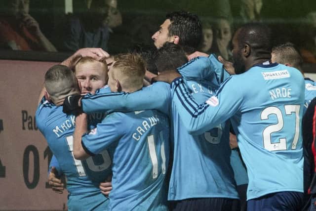 Ziggy Gordon, second left, is mobbed by his Accies team-mates. Picture: SNS Group