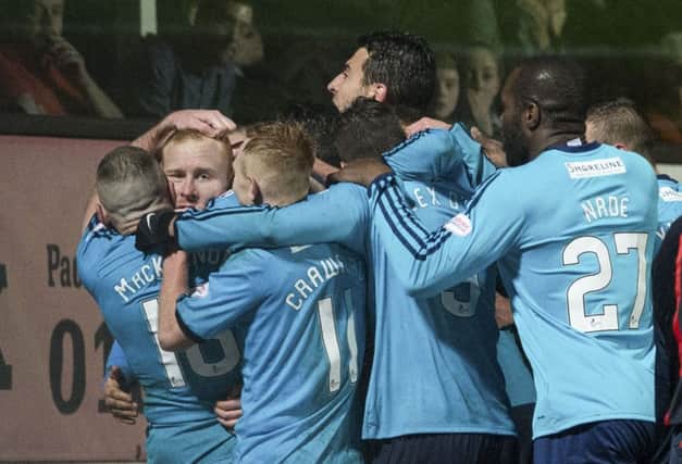 Ziggy Gordon, second left, is mobbed by his Accies team-mates. Picture: SNS Group
