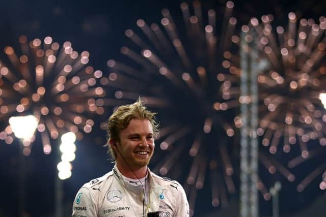 Mercedes driver Nico Rosberg celebrates after winning the Abu Dhabi GP at the Yas Marina Circuit. Picture: Getty Images