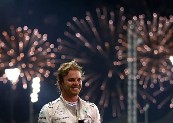 Mercedes driver Nico Rosberg celebrates after winning the Abu Dhabi GP at the Yas Marina Circuit. Picture: Getty Images